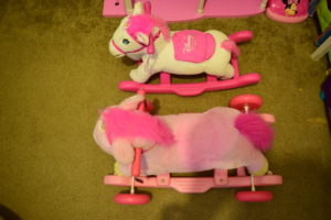 Small and Large Disney princess pink plush rocking ponies horses view from above
