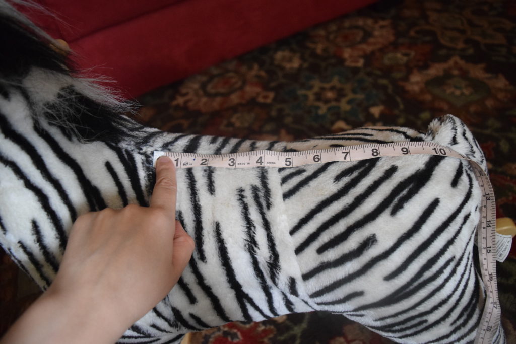 Happy Trails plush zebra rocking horse seat length is 10 inches.