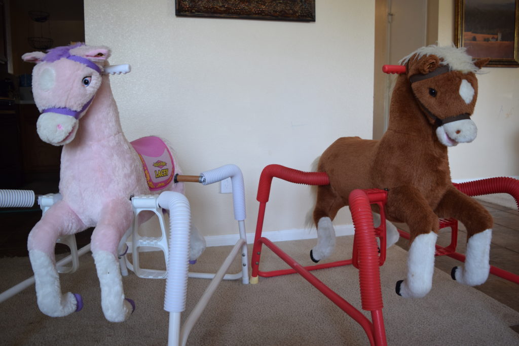 Compare pink and brown plush Rockin Rider spring horses
